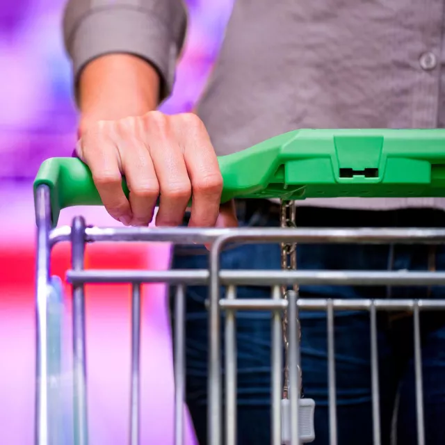 Image of cart handle with hand on close-up